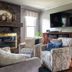 Glenn Meadow Bed and Breakfast in South Haven living room with brick fireplace, armchairs and wall-mounted TV