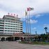 Jinshan Hotel in Shanghai with flagpoles, arched entrance, and exterior view