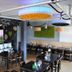 Chillten Bottrop restaurant with black tables, chairs, chalkboard walls, and modern pendant lighting