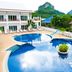 Nadivana Serviced Apartment in Krabi with a resort pool and mountain backdrop