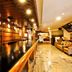 Welcome Hotel at Srinagar lobby with wooden reception desk, seating area and polished marble floor