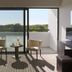 Christofinia Hotel in Ayia Napa room with balcony, two chairs and table overlooking greenery