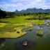 The Suites At Mount Malarayat in Lipa City with lush golf course, water features, and mountain views
