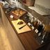 Breakfast buffet at Hotel Planaiblick in Schladming with pastries, rolls, juice, and glassware