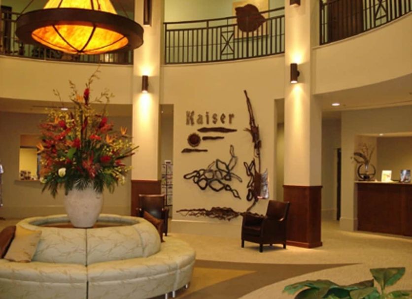 Crystal Towers Gulf Shores lobby with floral centerpiece, curved seating, and decorative wall art