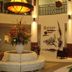 Crystal Towers Gulf Shores lobby with floral centerpiece, curved seating, and decorative wall art