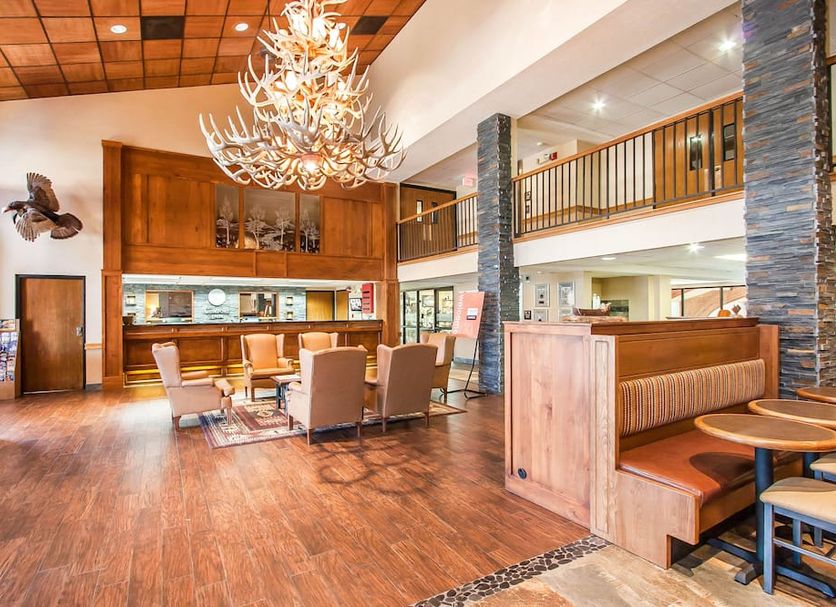 Comfort Inn at Thousand Hills in Branson lobby with chandelier, wood floors, seating area and upper balcony