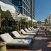 The Social Hub Barcelona Poblenou rooftop terrace with lounge chairs and city views in Barcelona