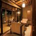 Ooedo Onsen Monogatari Wanwan Resort Yataya Shotoen in Kaga with a covered balcony seating area at night