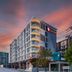 Travelodge Phuket Town in Phuket City, modern hotel exterior at sunset with balconies and street view