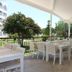 Serra Park in Side: open-air terrace dining area with white tables, chairs, and garden views