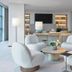 Four Seasons Hotel Silicon Valley at East Palo Alto lounge with white chairs, coffee table and built-in shelves in Palo Alto