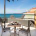 Hotel Nafpaktos balcony with table and chairs overlooking the sea in Nafpaktos