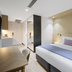 Haberfield Hotel, Sydney: modern guest room with king bed, desk and wall-mounted TV