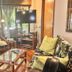 Maui What a Wonderful World Bed & Breakfast in Kīhei living room with wicker seating and TV