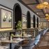 Europäischer Hof in Baden-Baden dining room with arched mirrors, tufted booths and pendant lights