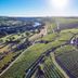Romantik Hotel Zur Schwane in Volkach, aerial view over vineyards and nearby river valley