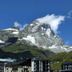 Hotel Sporting in Breuil-Cervinia with alpine mountain backdrop and buildings at the base