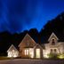 Rokeby Manor in Invergarry at dusk, stone hotel exterior glowing under a deep blue sky
