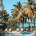 Club Seabourne Hotel in Culebra with palm trees, poolside loungers, and ocean view