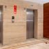 The Vijay Park Chennai elevator lobby with two stainless steel elevators in Chennai