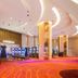 Winford Resort & Casino Manila casino floor with slot machines and bright pink carpet in Manila