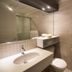Hotel Marineau Shawinigan bathroom with vanity, toilet, walk-in shower and towel rack