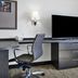 Candlewood Suites Killeen - Fort Hood Area by IHG desk with TV, task chair and wall lamp
