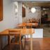 The Goose House Ubon in Ubon Ratchathani: cozy dining area with wooden tables and chairs
