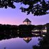 Aomoriya by Hoshino Resorts in Misawa with a lit tower reflected in a calm lake at dusk