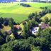 Aerial view of Hotel Saltenhof in Hoerstel surrounded by trees and green fields