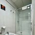 Pensión Peiró in Barcelona bathroom with bidet, shower stall, and glass shower door