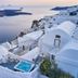 Santorini Mansion at Imerovigli with white terraces, a small hot tub, and caldera sunset views