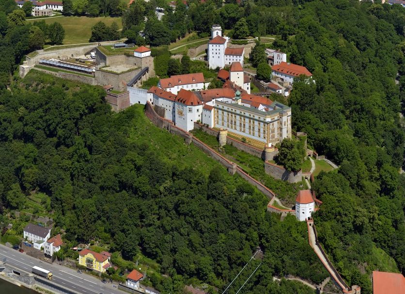 Hi Hostel Jugendherberge Passau in Passau, hilltop hostel complex surrounded by forest