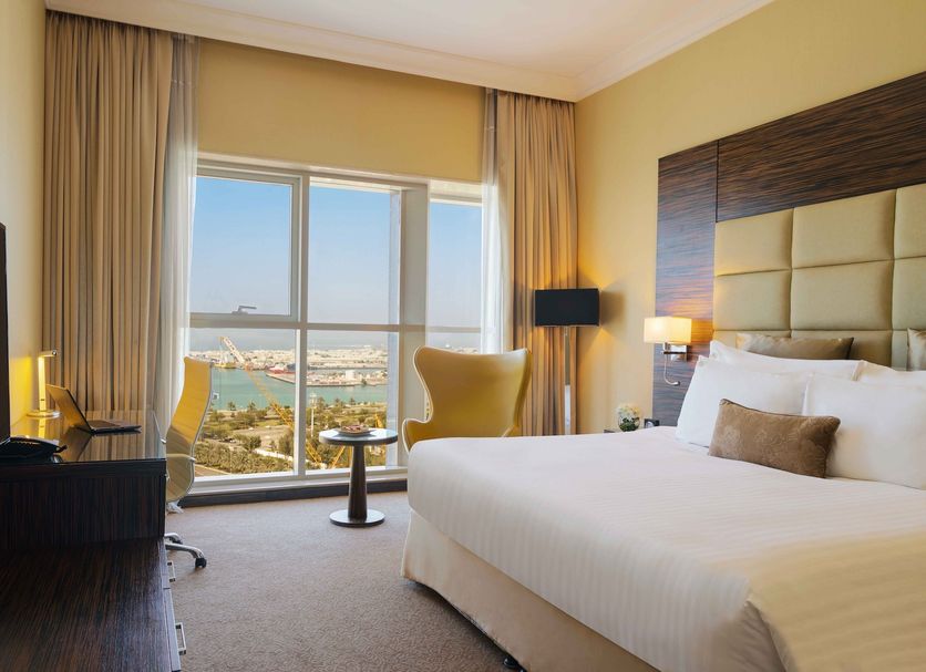 Jannah Burj Al Sarab Abu Dhabi room with harbor view through large windows