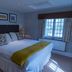 The Carpenters Arms Bristol guest room with double bed, bedside tables, and window light