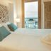 Domus Maris Relais Boutique Hotel in Sciacca, sea-view room with carved headboard and balcony