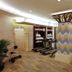 Nanjing Central Hotel fitness room in Nanjing with treadmills, exercise bikes and patterned columns