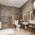 The Shankly Hotel Liverpool bathroom with shower, toilet, sink and accessible grab bars
