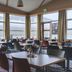 The Cliff Hotel in Neskaupstadur dining room with large windows and mountain views