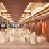 Mercure Chandigarh Tribune Chowk banquet hall in Chandigarh with round dining tables and chairs