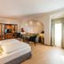 Hotel Kaiserhof Eisenach guest room with double bed, seating area, and arched alcove