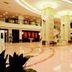 Jinshan Hotel Shanghai lobby with polished marble floor, spiral staircase, and ornate columns