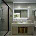 Qunxian Hotel in Guangzhou bathroom with double sink vanity, glass shower, and toilet