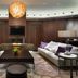 Hilton Kyiv lounge with sofas, fireplace, wall-mounted TV and chandelier in Kyiv