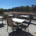 La Quinta Inn by Wyndham San Diego - Miramar patio with outdoor tables and hillside views
