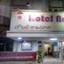 Hotel Rajmata Pvt Ltd in Hyderabad exterior with illuminated entrance and reception sign