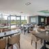 Moyvalley Hotel & Golf Resort in Moyvally, restaurant with tables and chairs and large windows overlooking greenery