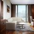 Minsk Marriott Hotel in Minsk: suite with sofa, dining table and city view through large window
