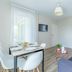 Appart'City Confort Tours apartment with dining area, sofa, TV and bright window in Tours